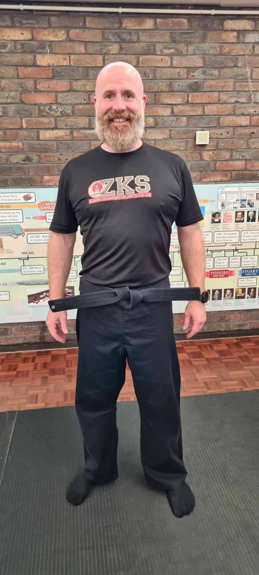 Simon Watts wearing his ZKS shirt and black belt