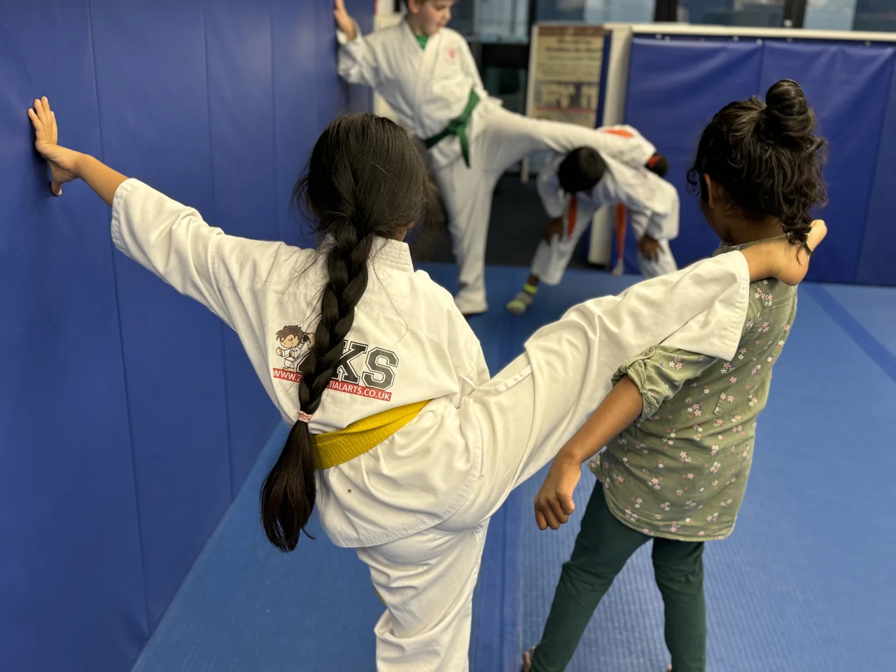 Junior MA students practising kicking technique in the ZKS training room