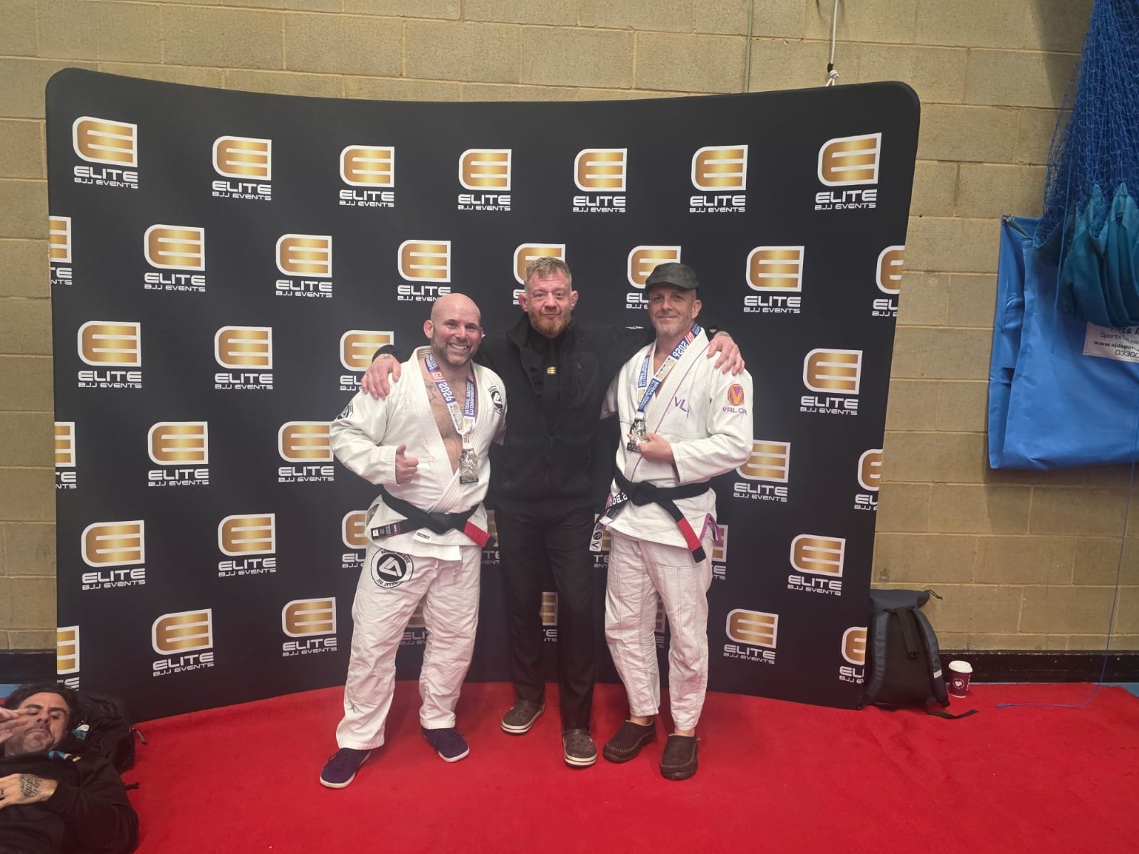 Sensei Ben and Kevin Capel with a fellow competitor at an Elite BJJ event